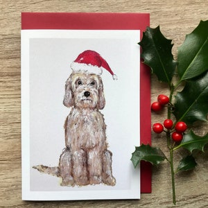 Cartão de cachorro e chapéu de natal