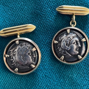 Cartier Manschettenknöpfe. Gold mit antiken griechischen Münzen.