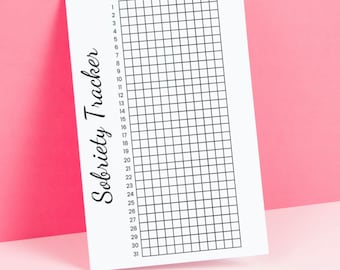 May include: A black and white sobriety tracker printable with a grid of 31 days and 12 months, labeled January through December. The text "Sobriety Tracker" is written vertically on the left side of the printable.
