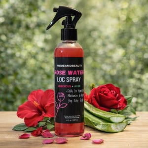 May include: A bottle of Pride and Beauty Rose Water Loc Spray with hibiscus and aloe. The spray bottle is next to red hibiscus flowers, a red rose, and aloe vera leaves. The bottle is 237 ml.