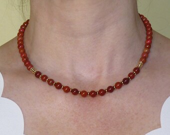 Red Jasper and Gold Tone Hematite Beaded Necklace. Includes Stainless Steel Extension. Great Gift for someone special.