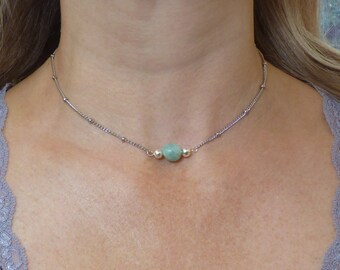 Blue Amazonite Gemstone Necklace. Oval Shaped Semi Precious Stone with two Silver Plated Beads on a Stainless Steel Chain.