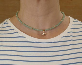 Aquamarine Faceted Beaded Gemstone Necklace with Gold Plated Faceted Rondelles and Gold Plated Starfish Pendant with Inlaid Zircon Diamonds.