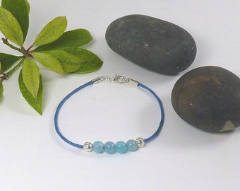 Blue Onyx Agate Gemstone Bracelet. Four Round Semi Precious Stones and Two Silver Plated Beads on a Waxed Cotton Cord.