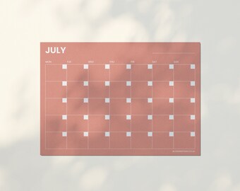 May include: A pink printable July calendar with white squares for each day of the month. The calendar has the days of the week labeled at the top: Mon, Tue, Wed, Thu, Fri, Sat, Sun. The text "JULY" is at the top of the calendar in white text. The text "BLOSSOMANDTHISTLE.CO.UK" is at the bottom of the calendar in white text.