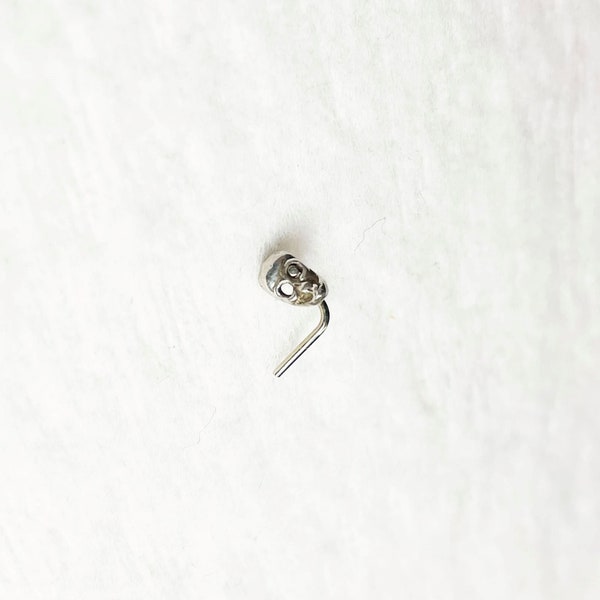 white 14k gold nostril screw with SKULL