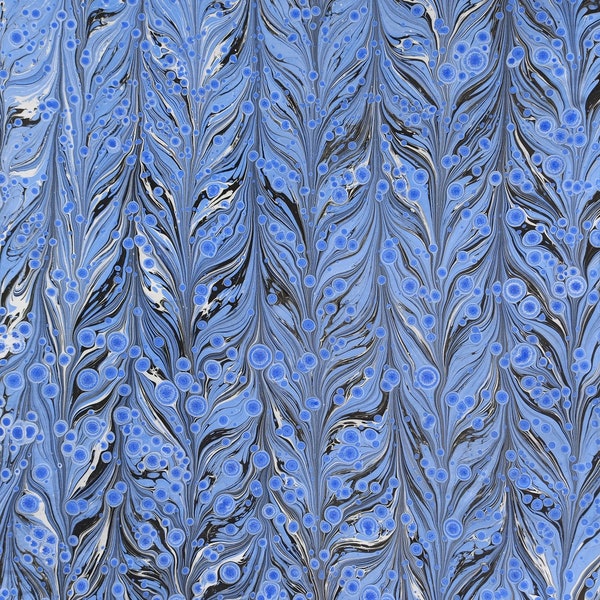 Blue hand marbled paper for bookbinding and paper crafts.Tiger eye pattern.