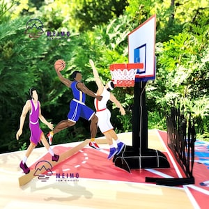 May include: A pop-up card with a basketball theme. The card features three basketball players, one of whom is shooting a basketball into a hoop. The card is made of paper and has a red, white, and black color scheme. The card also has the text 