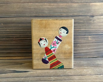 vintage Japanese wood box with kokeshi doll design