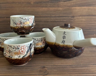 vintage Japanese teapot and 4 cups with raised blossom design with gold accents