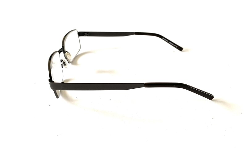 May include: A pair of rectangular-framed eyeglasses with a dark gray metal finish. The glasses have clear lenses and a minimalist design, suitable for everyday wear. The temples are straight and extend to the ear pieces.