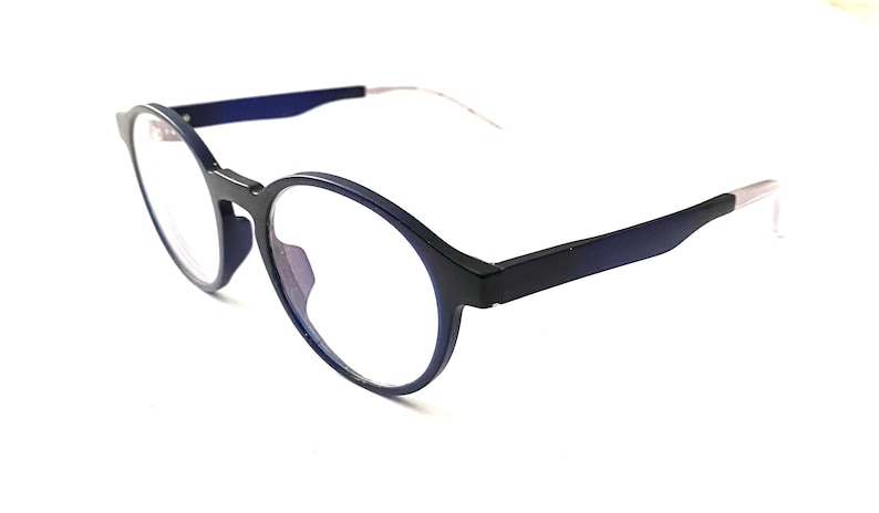 May include: A pair of round, blue-framed eyeglasses with clear lenses. The frames have a subtle gradient effect.
