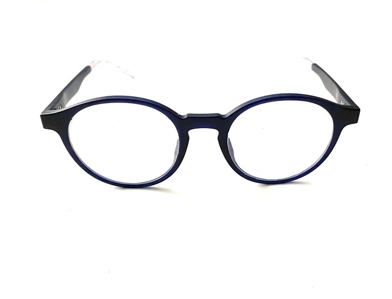 May include: A pair of round, blue-framed eyeglasses with clear lenses.