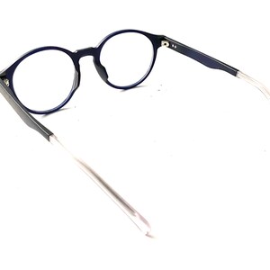 May include: A pair of blue round-framed eyeglasses with clear lenses and thin silver arms.