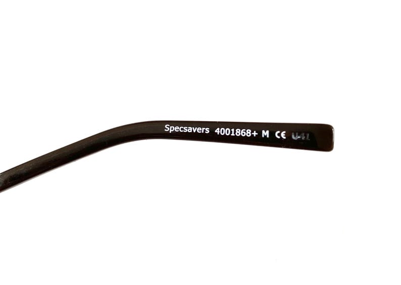 May include: Close-up of a dark brown eyeglass arm with the text "Specsavers 4001868+ M CE U-41" printed in white. The arm curves slightly and is set against a white background.