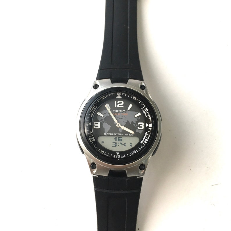 swatch black and orange watch
