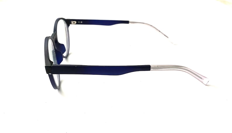 May include: Blue and silver eyeglasses with round lenses and a thin metal frame.