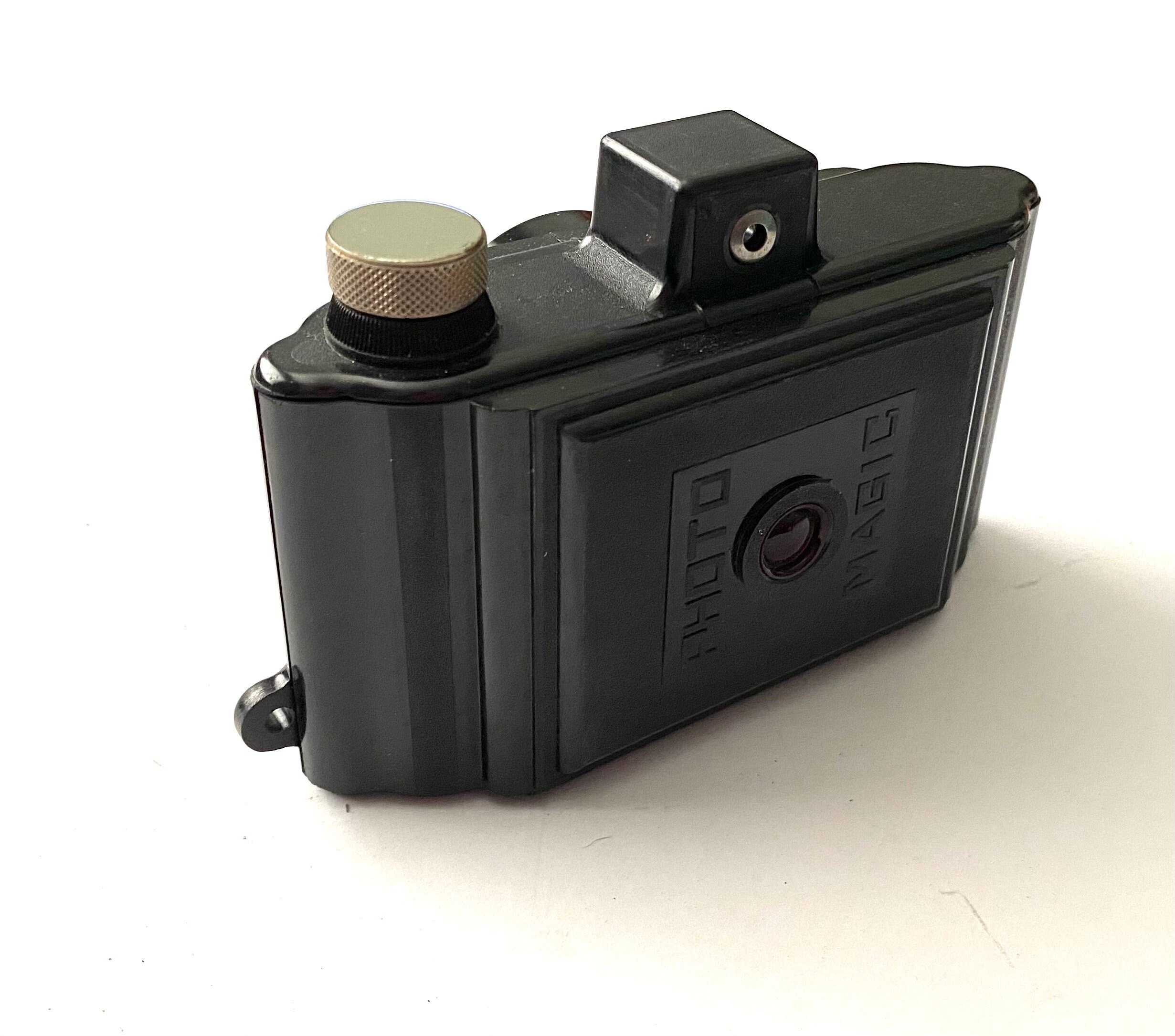 A Coronet Midget green bakelite miniature camera Provenance: Part of a vast single owner collectio