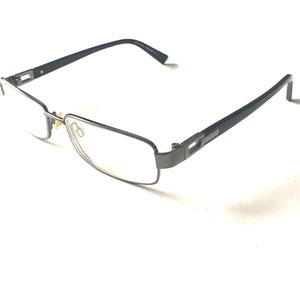 May include: A pair of black metal eyeglasses with rectangular lenses.
