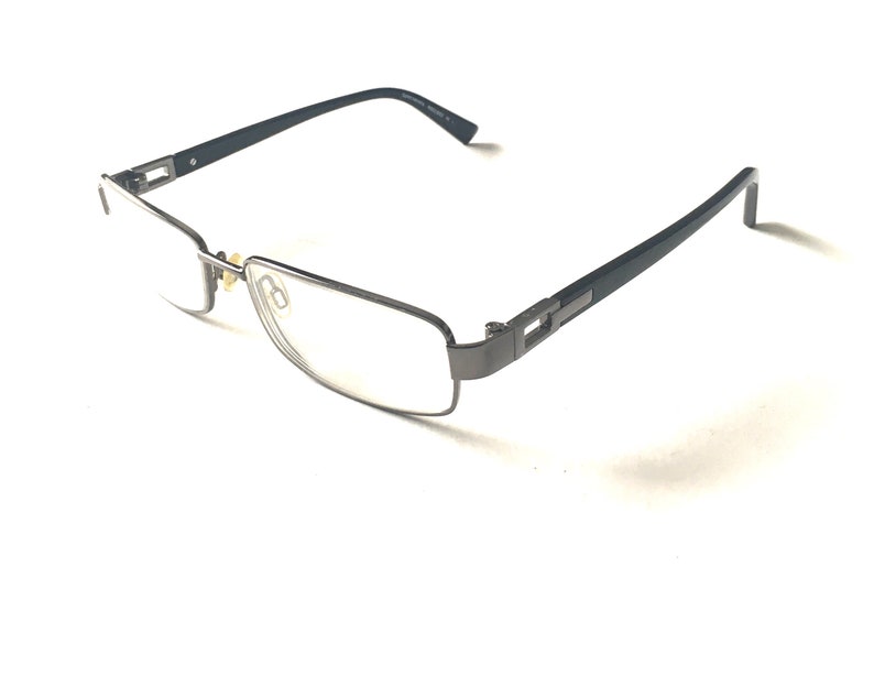 May include: A pair of black metal eyeglasses with rectangular lenses.