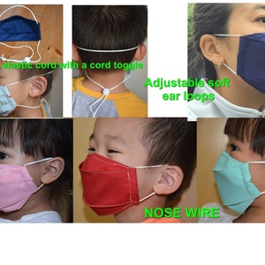 May include: A set of six colorful fabric face masks with adjustable ear loops and a nose wire. The masks are shown on children and adults. The masks are made of soft, breathable fabric and are comfortable to wear. The masks are available in a variety of colors and patterns.