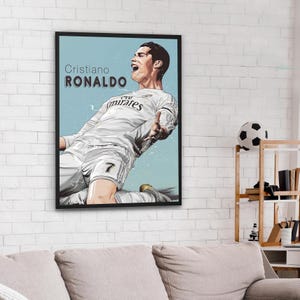 May include: A digital illustration of Cristiano Ronaldo wearing a white football shirt with the text "Cristiano RONALDO" and "Fly Emirates" on the shirt. The background is a light blue colour.