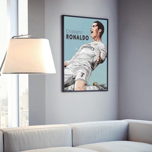 May include: A black and white illustration of Cristiano Ronaldo in a white football shirt with the text "Cristiano Ronaldo" and "Fly Emirates" on it. He is in mid-air, kicking a football.
