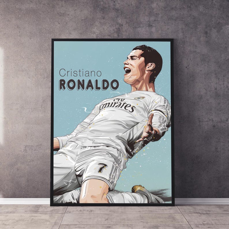 May include: A black and white illustration of a football player in a white jersey with the text "Fly Emirates" on the front. The player is in mid-air, kicking the ball. The text "Cristiano Ronaldo" is at the top of the image.