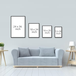 May include: Four black picture frames with white text showing different sizes: 24 x 36 inch, 18 x 24 inch, 16 x 20 inch, and 12 x 18 inch. The frames are hanging on a light gray wall above a light gray couch.