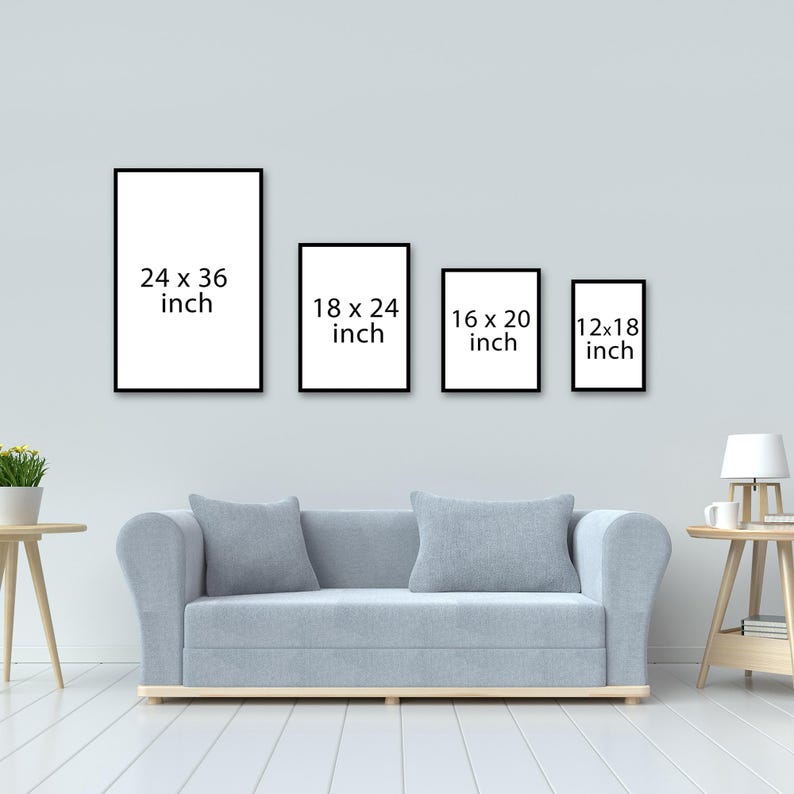 May include: Four black picture frames with white text showing different sizes: 24 x 36 inch, 18 x 24 inch, 16 x 20 inch, and 12 x 18 inch. The frames are hanging on a light gray wall above a light gray couch.