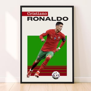 May include: A black and white poster with a red and green background featuring Cristiano Ronaldo, a soccer player, in a red and green jersey, kicking a soccer ball. The poster has the text "Cristiano RONALDO" at the top.