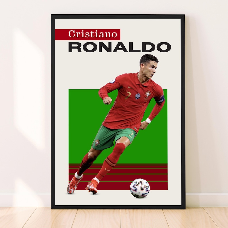 May include: A black and white poster with a red and green background featuring Cristiano Ronaldo, a soccer player, in a red and green jersey, kicking a soccer ball. The poster has the text "Cristiano RONALDO" at the top.