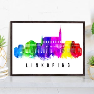 May include: A watercolor painting of the Linköping skyline in rainbow colors. The city's buildings are depicted in a stylized way, with a focus on the tallest building in the center.