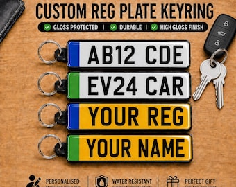 May include: Four rectangular custom registration plate keyrings with metal split rings. Two feature white backgrounds with black text, and two feature yellow backgrounds with black text. Each has a colored side strip and a high gloss finish.