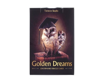 May include: A black box featuring two owls, one wearing a graduation cap, perched on a stack of books. The words "Golden Dreams" and "Lenormand Oracle Cards" are in gold lettering. The top of the box reads "Tarocco Studio."