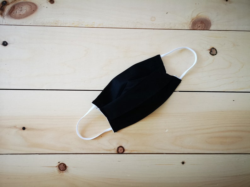 May include: A set of three ceramic mugs with a speckled, matte finish. The mugs are in shades of cream, light gray, and dark gray. Each mug has a simple, minimalist design, perfect for coffee or tea.