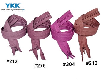 Può includere: Quattro cerniere lampo del marchio YKK in tonalità viola e marrone sono esposte su sfondo bianco. Ogni cerniera è ad anello ed etichettata con un numero. Il logo e lo slogan YKK sono in alto a sinistra.