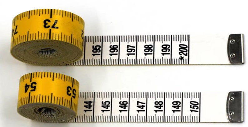 May include: Two yellow measuring tapes with black markings. The top tape reads "73" and the bottom tape reads "53". The tapes are extended and show the numbers 195 to 200 and 144 to 150.