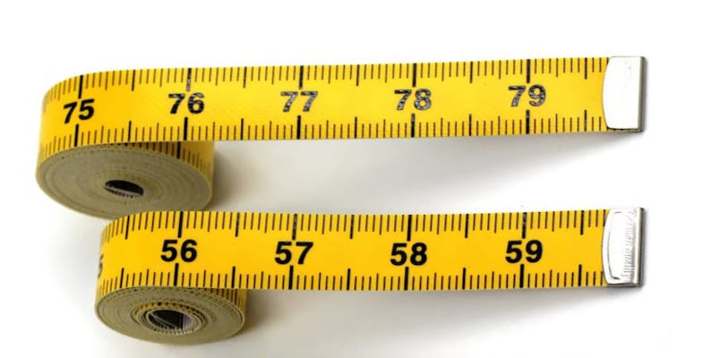 May include: Two yellow measuring tapes with black numbers. The top tape shows numbers 75 through 79. The bottom tape shows numbers 56 through 59.