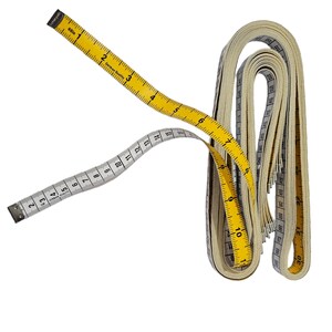 May include: Two measuring tapes, one yellow and one white, are rolled up together. The yellow tape has black markings and the text "German Quality" printed on it. The white tape has black markings and the text "30m" printed on it.