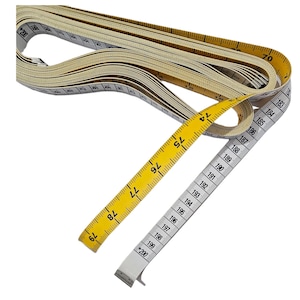 May include: A yellow and white measuring tape with black markings. The tape is extended to show the numbers 74 to 200. The tape is rolled up and the end is visible.