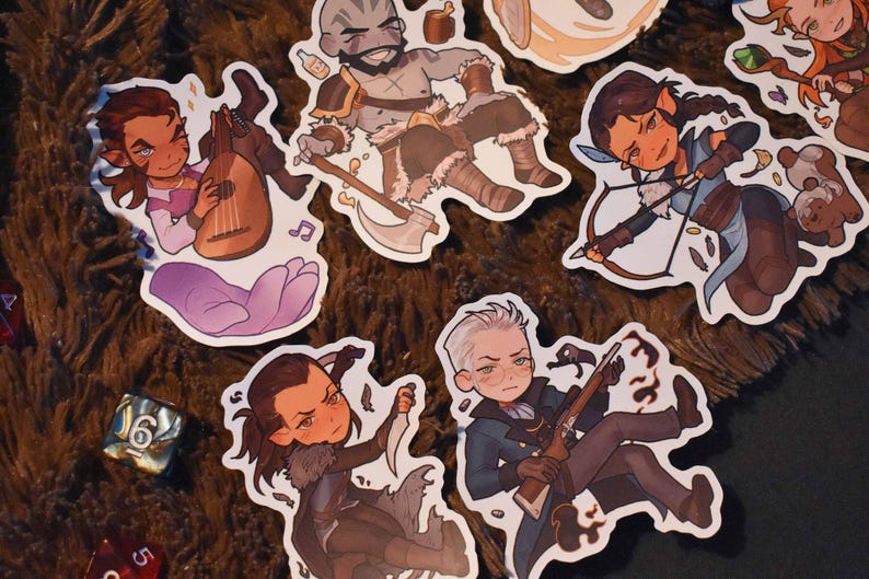 May include: A set of colourful stickers featuring various characters, including a warrior with an axe, a bard with a lute, a ranger with a bow and arrow, a rogue with a dagger, and a wizard with a staff. The stickers are on a brown, textured surface.