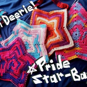 May include: Four crocheted star-shaped bags in different colors, including pink, purple, blue, and orange. The bags have straps and are labeled "Pride Star-Bags!"