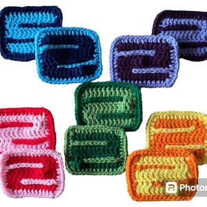 May include: Set of ten crocheted coasters in various colors, including blue, purple, green, pink, orange, and yellow. Each coaster features a simple geometric design.