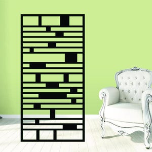 May include: A tall, rectangular black metal room divider featuring a geometric pattern of horizontal bars of varying lengths and widths, connected by vertical segments to create an open, grid-like structure with negative space throughout.