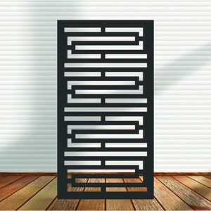 May include: Black metal room divider with a geometric pattern. The divider is made of thin metal bars that are arranged in a repeating pattern of squares and rectangles.