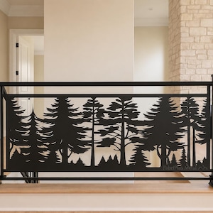 May include: A black metal stair railing panel featuring a laser-cut silhouette of a dense pine forest. The rectangular panel is framed by vertical posts and horizontal bars, with the text FabriPlus Metal visible in the lower right corner.