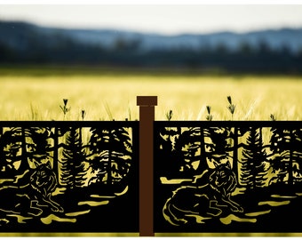 May include: Black metal fence panels with a wolf and forest silhouette design. The wolf is lying down, and the trees are in the background. The fence posts are brown, and the background is a field.