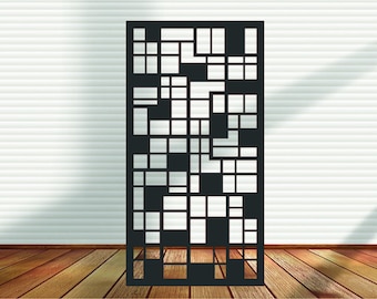 May include: A black decorative screen with a geometric pattern of various sized rectangles and squares. The screen is made of a solid material and stands vertically. The background features a white wall and a wooden floor.