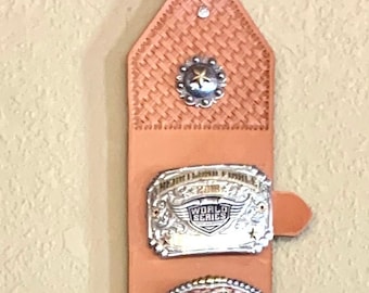 10 Trophy Buckle Display - This is an example of the different options and colors available for order.